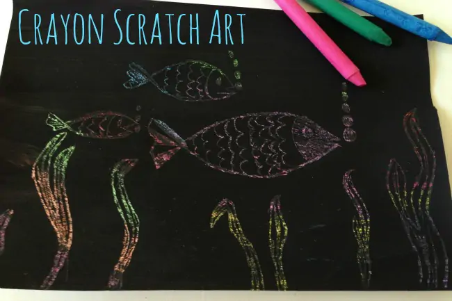 Crayon Art - How to Scratch Art with Wax Crayons - image shows finished scratch artwork with black background and rainbow fish and seaweed