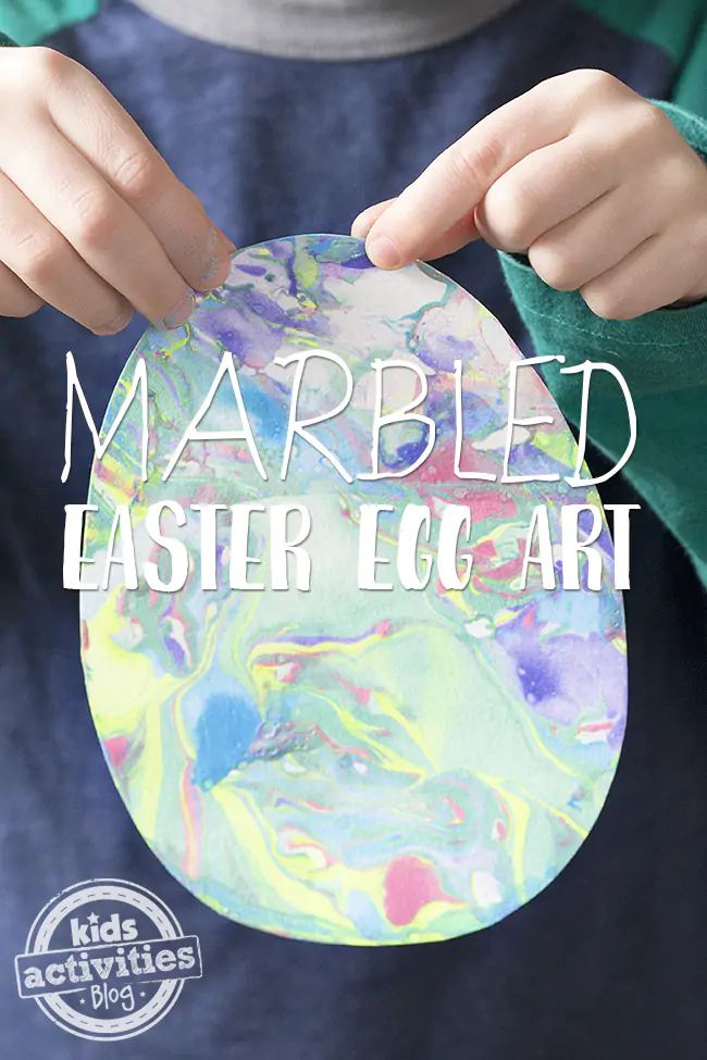 Marbled Easter Egg Art- child holding finished marbled egg art