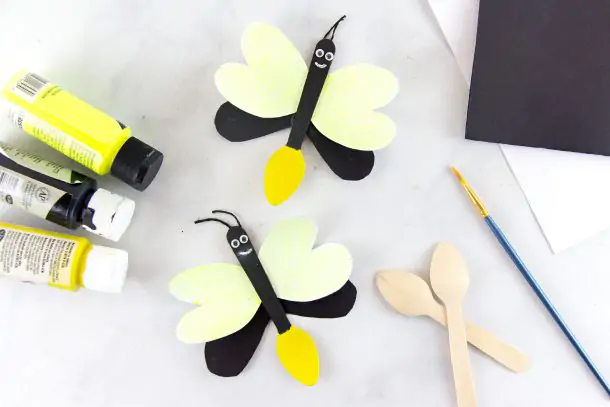 Alternative Firefly craft with glow in the dark yellow wings, a yellow butt, and made from wooden spoons.